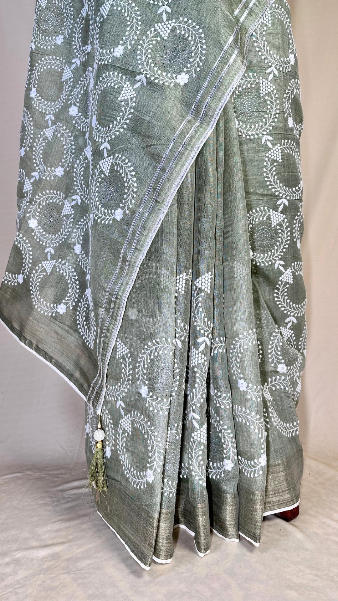 Elegant pista green tissue Saree with Embroidery border& Floral Motifs