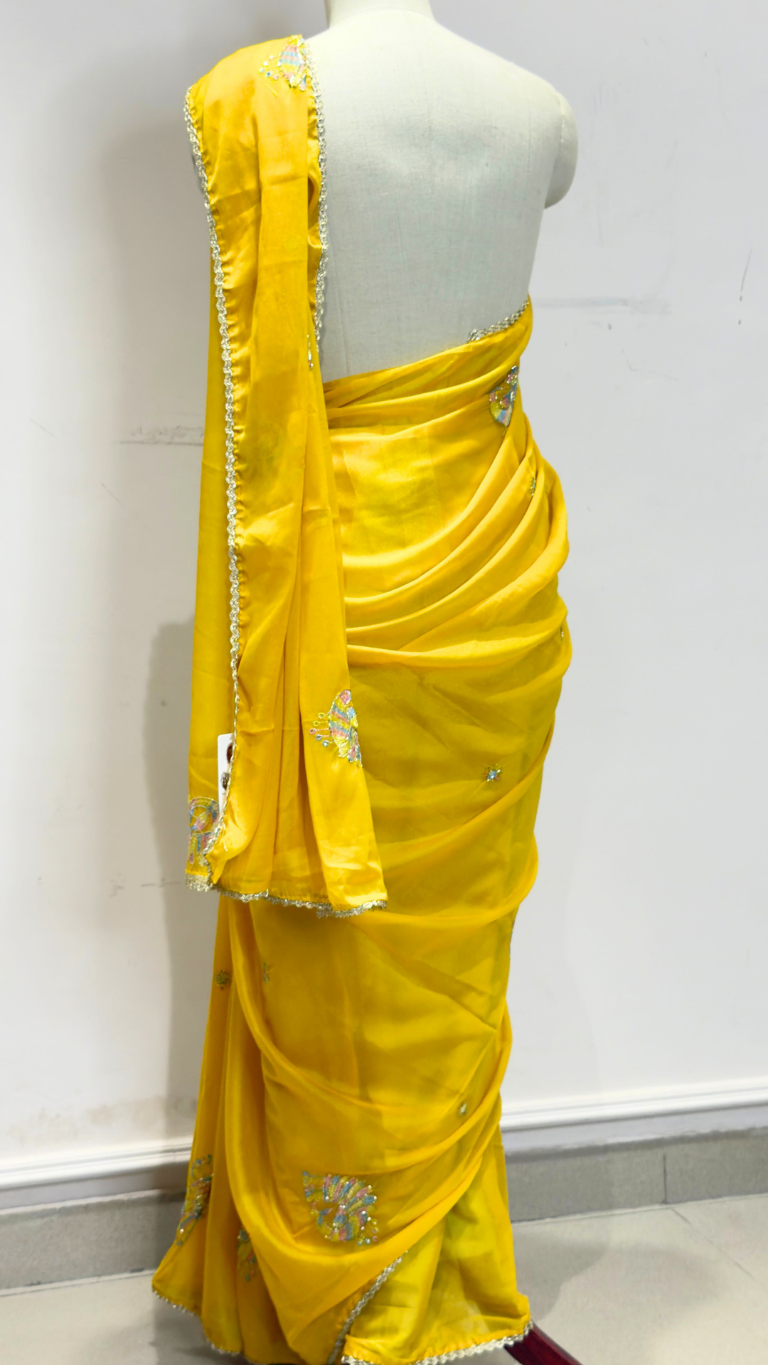 Banarashe Mustard Yellow Embroidered Saree with Multicolour Floral Motifs & Silver Lace Border