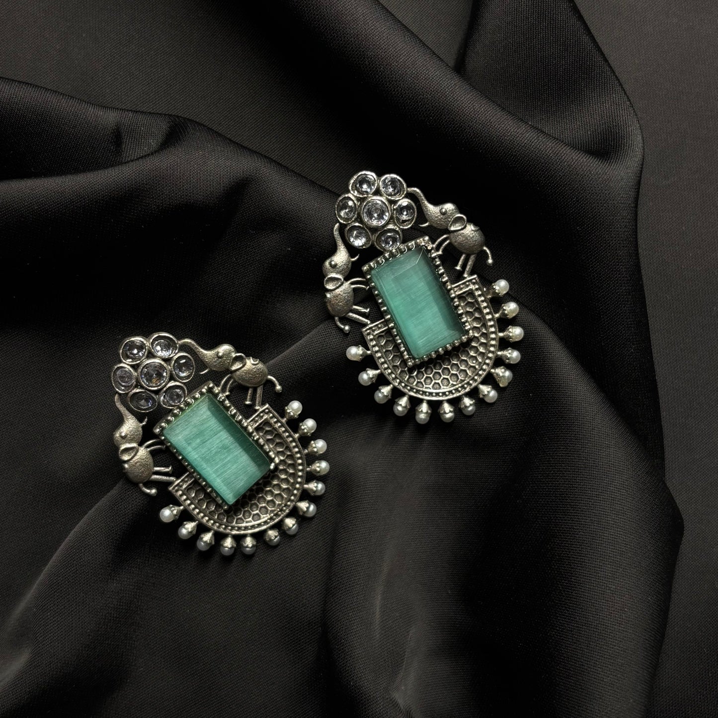 Oxidised German Silver Earrings with Light Green Stone & Elephant Motif