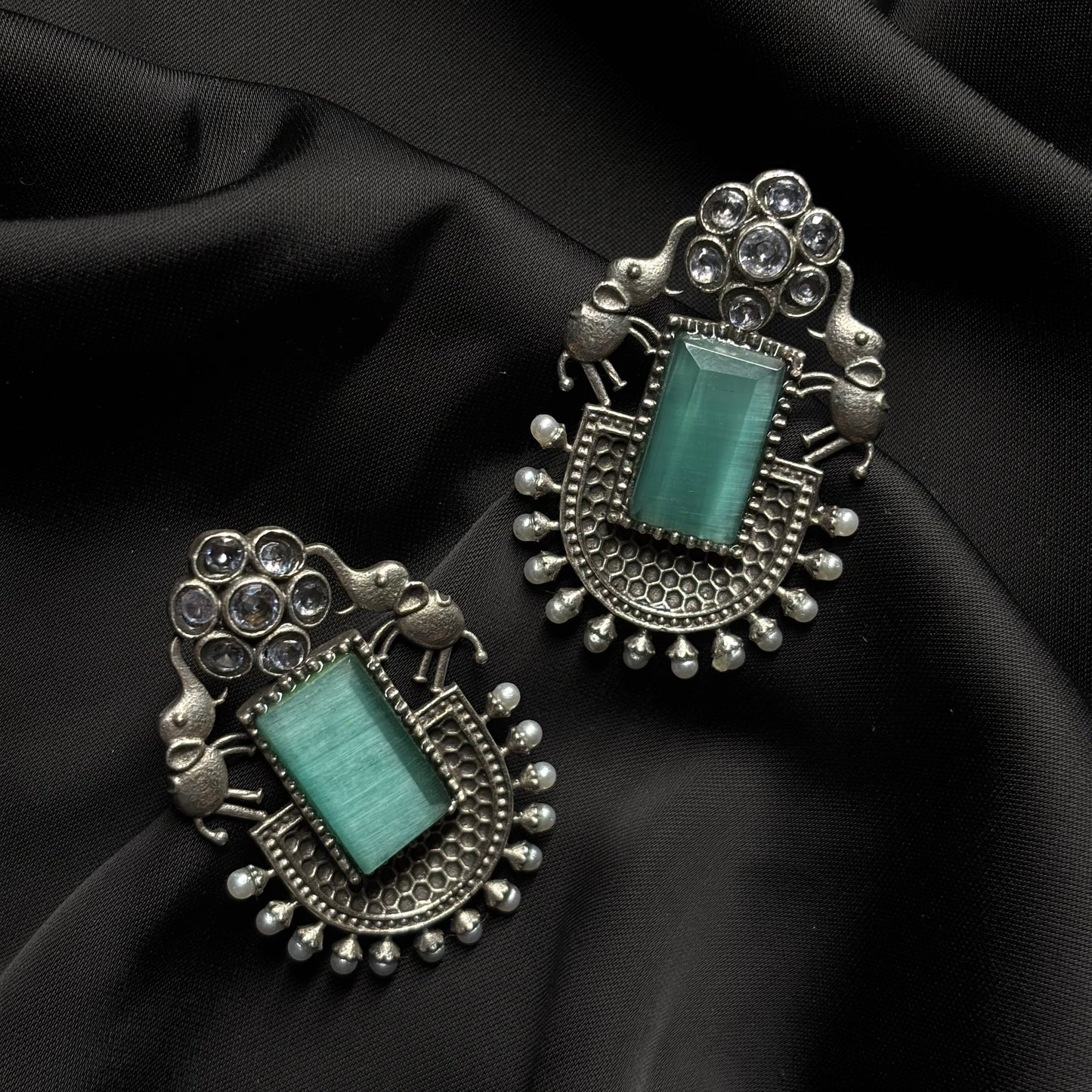 Oxidised German Silver Earrings with Light Green Stone & Elephant Motif
