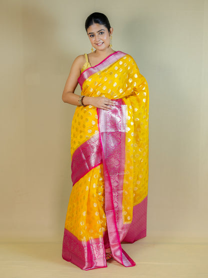 Yellow Silk Blend Saree with Pink Zari Border – Festive & Party Wear