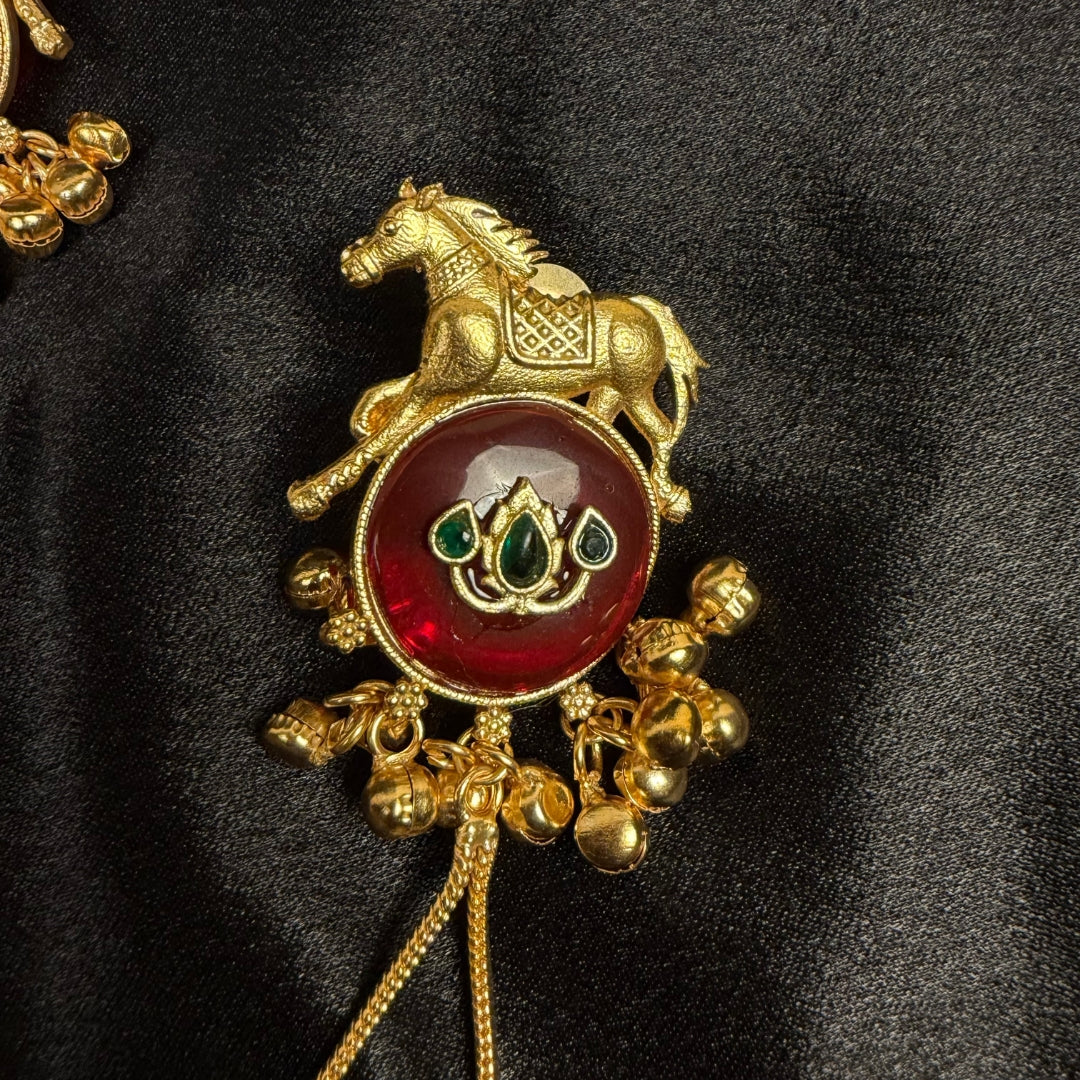 Traditional Gold Tone Horse Motif Earrings with Maroon Stone