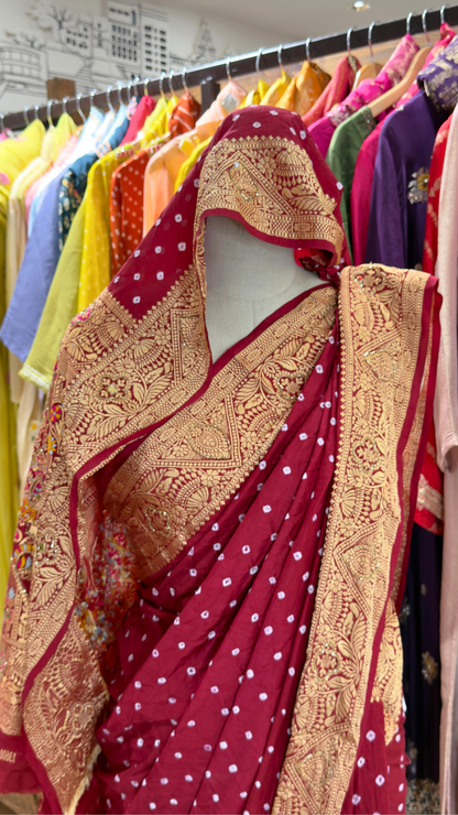 Designer Maroon Dola Silk Saree with Golden Zari Work & Bandhani Motifs – Printed Blouse Included