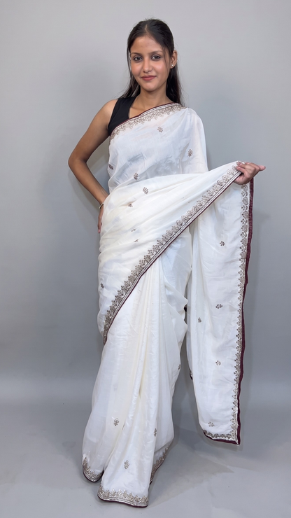 Banarashe Elegant White Georgette Saree with Delicate Zari Border