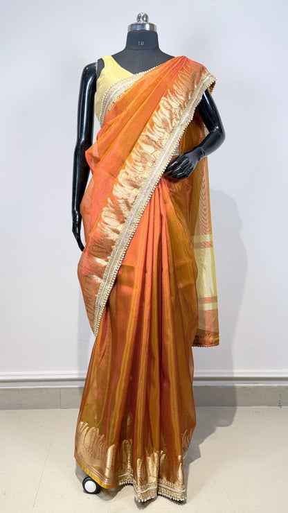 Orange Tissue Saree with Rich Zari Border & Moti Lace