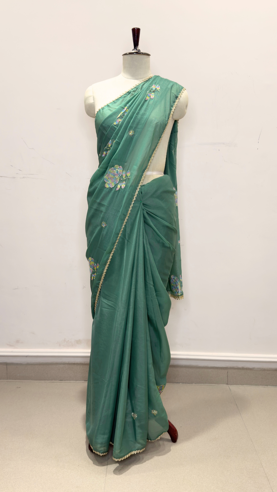 Banarashe Green Embroidered Saree with Multicolour Floral Motifs & Delicate Gold Lace Border