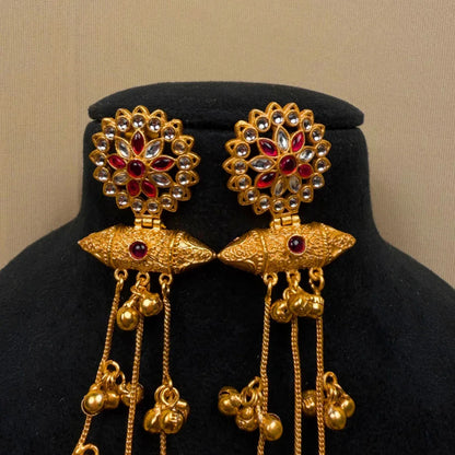 Traditional Gold Tone Jhumka Earrings with Red Stones