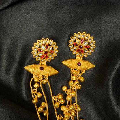 Traditional Gold Tone Jhumka Earrings with Red Stones