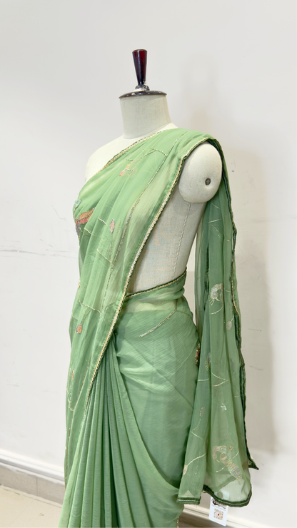 Banarashe Women’s Pastel Green Designer Saree with Multicolour Floral Embroidery & Golden Line Detailing