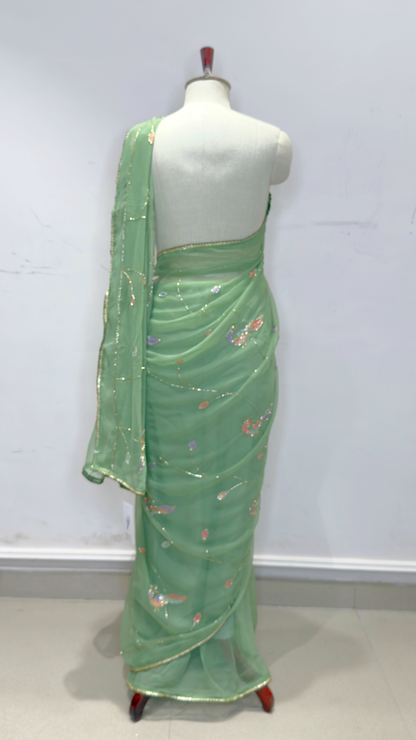 Banarashe Women’s Pastel Green Designer Saree with Multicolour Floral Embroidery & Golden Line Detailing