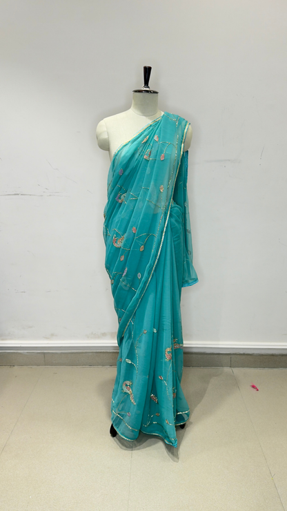 Banarashe Turquoise Blue Embroidered Saree with Floral Motifs & Golden Lace Border
