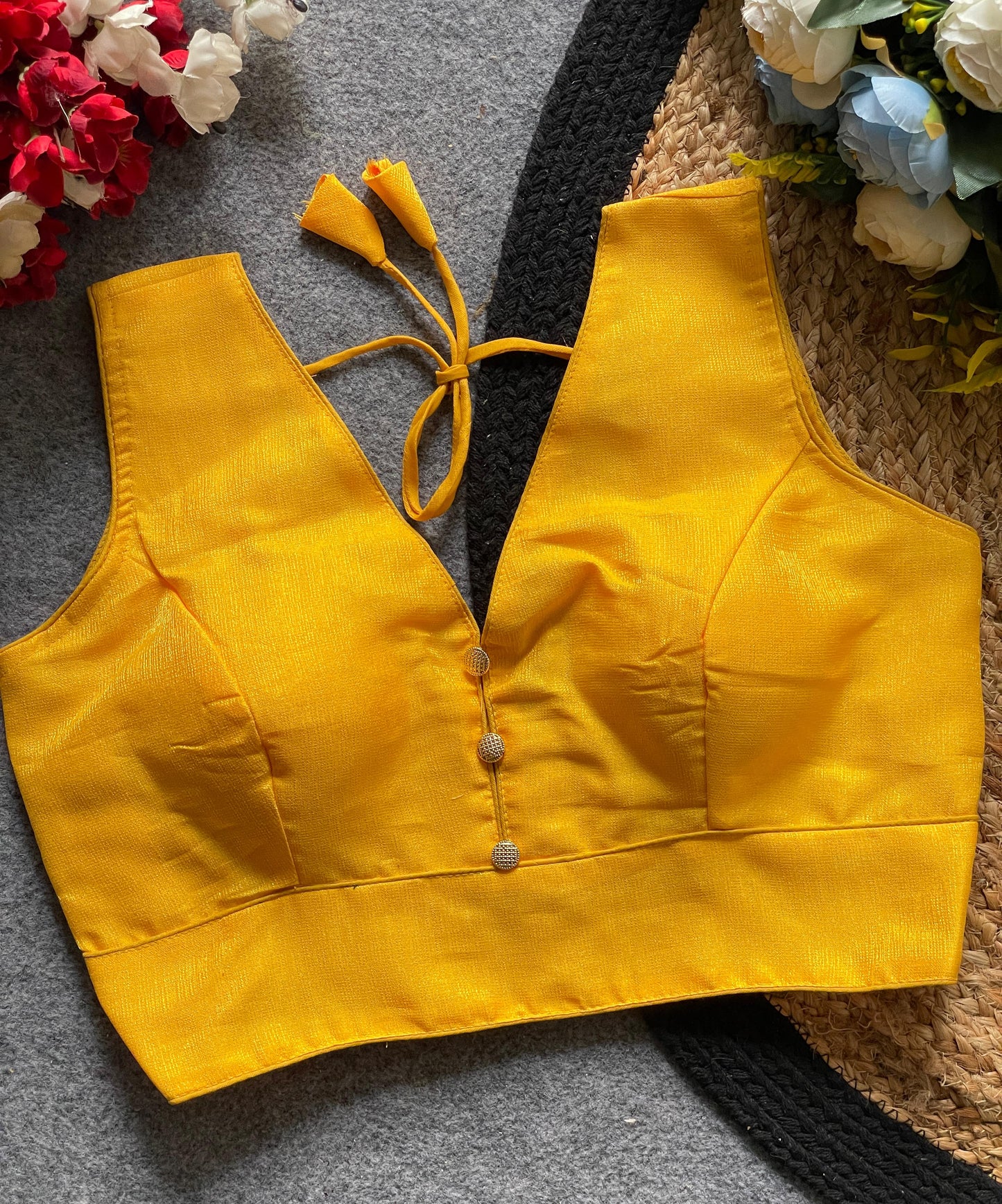 Readymade Sleeveless Blouse with Deep Neckline & Decorative Buttons