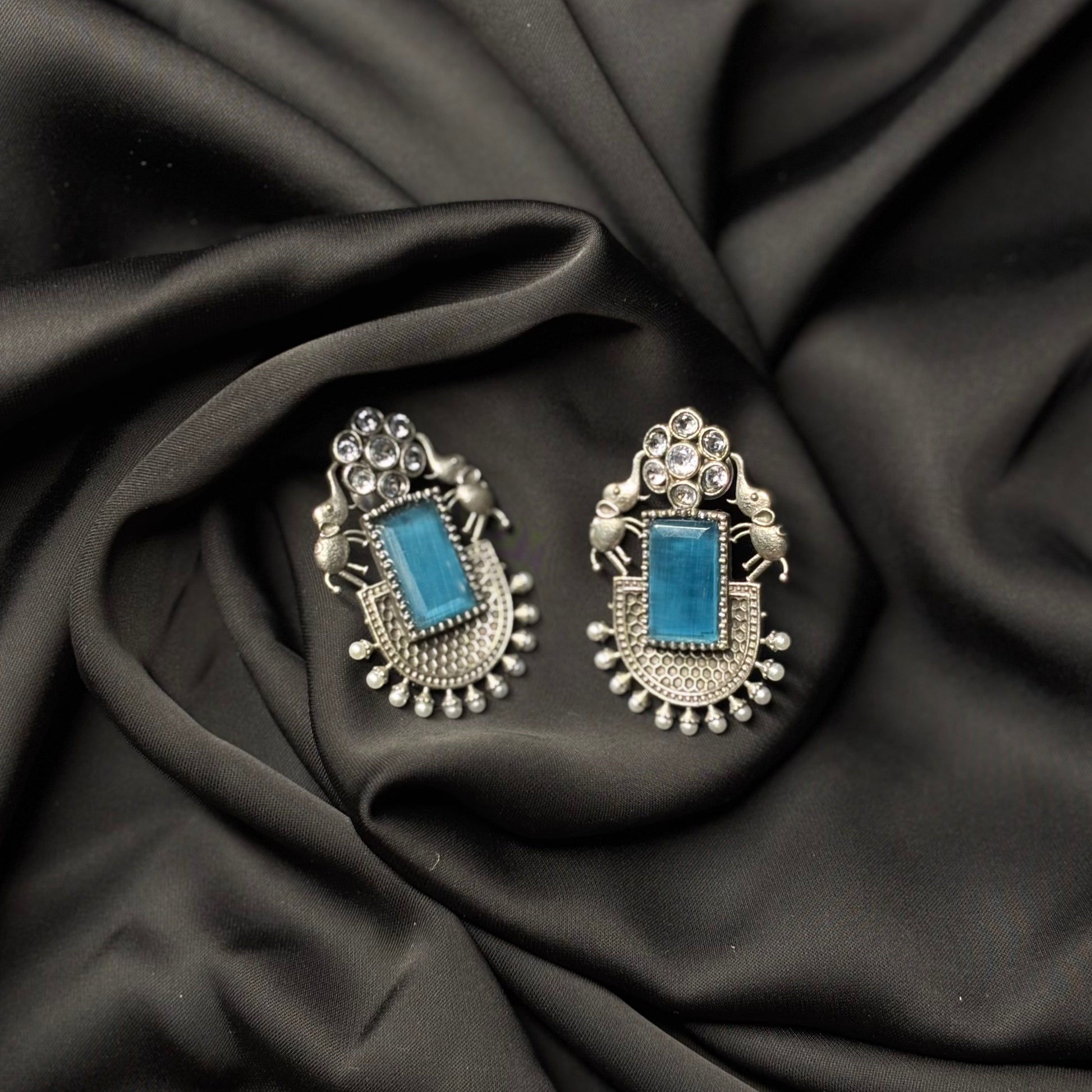 Oxidised German Silver Earrings with Sky Blue Stone & Elephant Motif