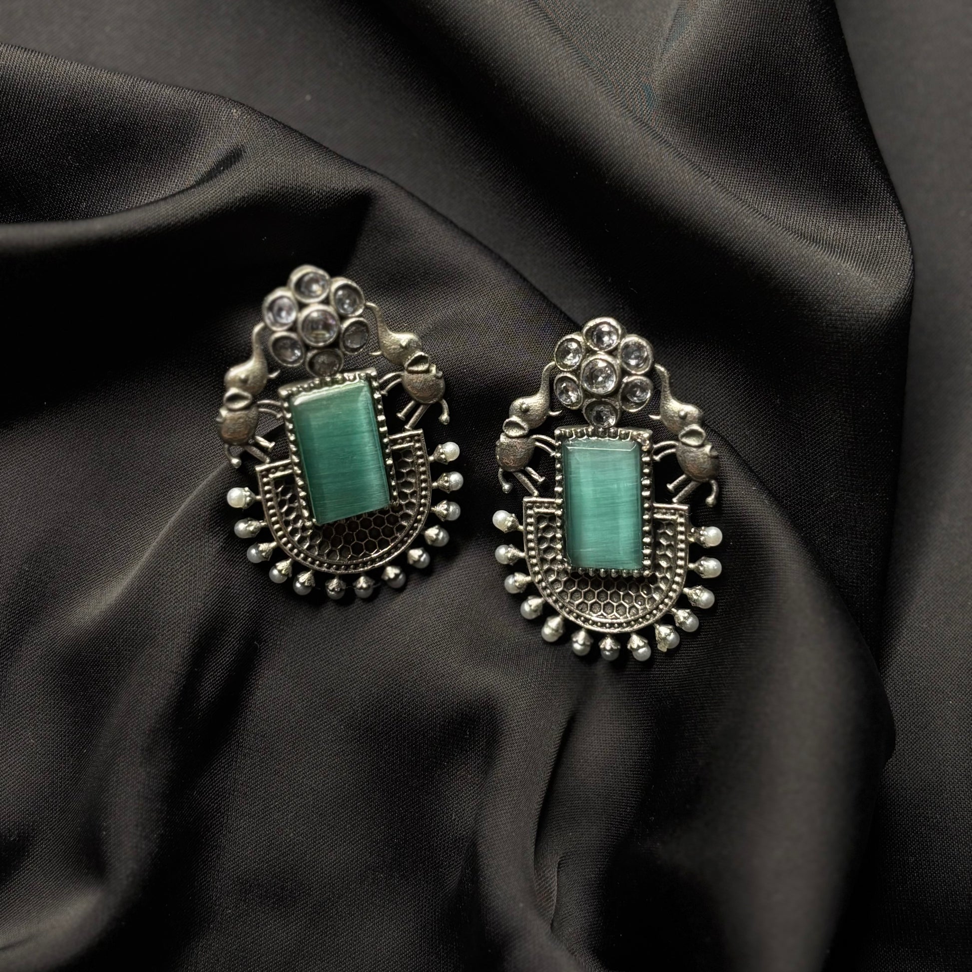 Oxidised German Silver Earrings with Light Green Stone & Elephant Motif